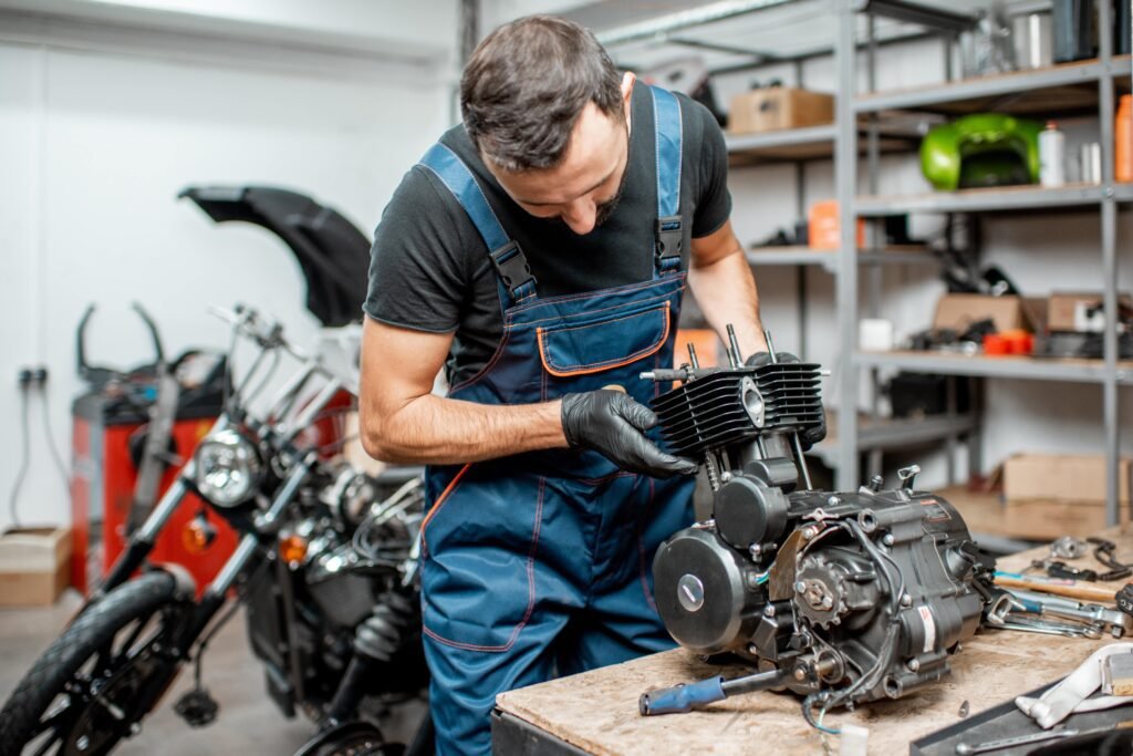 man-repairing-motorcycle-engine